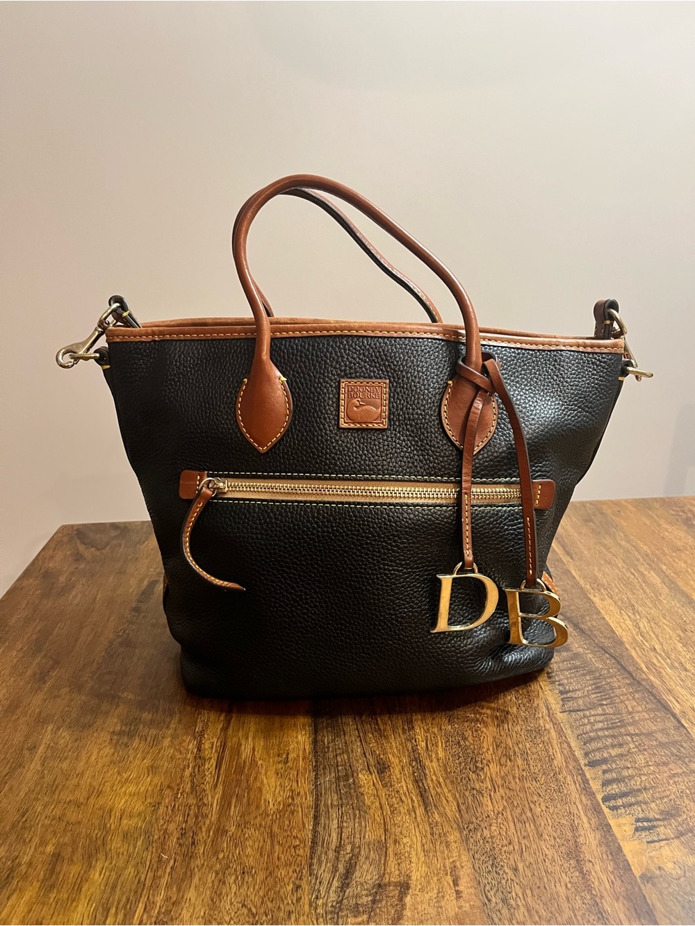 Dooney & Bourke Black Pebbled Leather Tote with Brown Trim and Gold Hardware